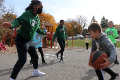 students playing basketball with athletes
