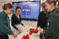 students stacking cups