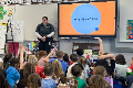 community professional speaking with students