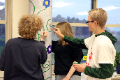 students painting pole