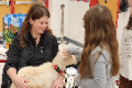 student petting goat
