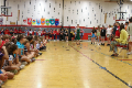 elementary students watching high school choir sing