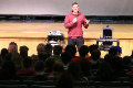 Justin Topa speaking with students