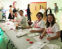 c v staff members welcoming students at homecoming