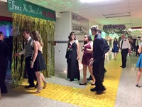 students walking into homecoming dance.