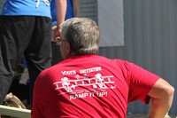 back of red shirt that says ramp it up initiative