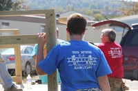 back of blue shirt that says ramp it up initiative