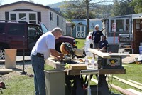 man working with saw to cut wood