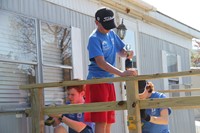 students drilling nails into deck