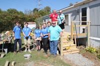 group with almost completed deck and resident