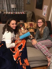 students reading on a couch