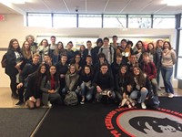 group of french exchange students in hallway of chenango valley high school