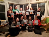 female students with pumpkins they painted