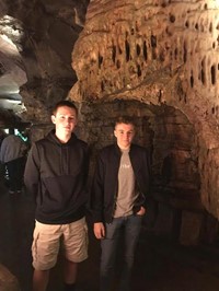 students smile for picture in howe caverns