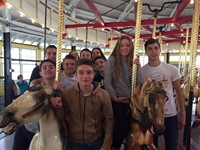 group of students riding carousel