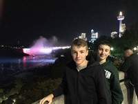 students by niagra falls at night