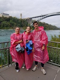 students at niagra falls wearing ponchos