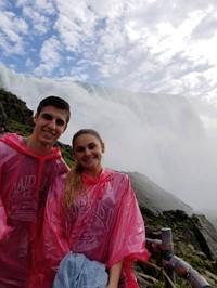 students smile for a picture at niagra falls