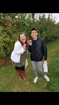 two students apple picking