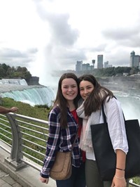 two female students in front of niagra falls