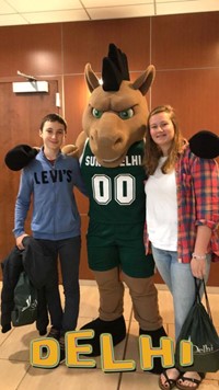 two students with delhi mascot