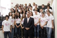 students smile in picture with binghamton mayor rich david