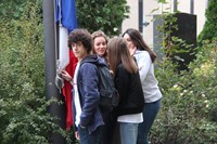 students about to raise france national flag in binghamton