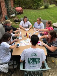 group of students tie dying shirts