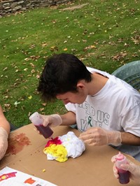 male student tie dying shirt