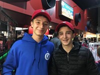 two male students at binghamton devils hockey game