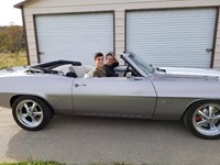 students in old fashioned car