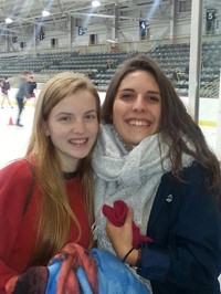 students smile at hockey rink