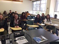 students smile sitting in classroom