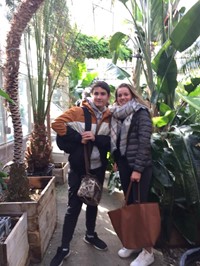 two students in green house