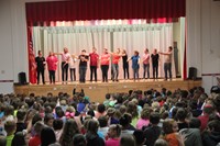 all of the middle school students stand together at the end of the play