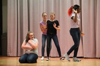 female students acting in play