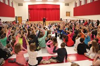 wide shot of deputy stapleton talking to students