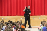 deputy stapleton shows students a cell phone