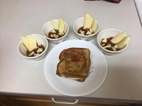 close up of grilled cheese sandwich and apples