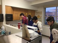 four male students at work in f a c s classroom