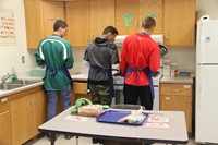 group of students making grilled cheese