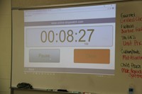 online stop watch displayed on white board