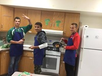 students making grilled cheese in f a c s kitchen