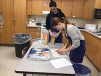 students working on cutting tomatoes