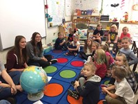 students smile with class of port dickinson elementary students