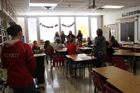 french students talking in elementary classroom