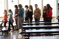 elementary students giving french exchange students a tour of chenango bridge cafeteria