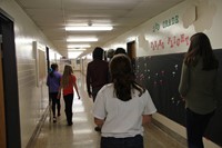 elementary students and french exchange crew in chenango bridge hall way