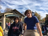 students in front of sign that reads cave of the winds