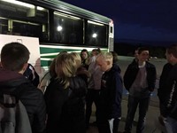 french exchange students packing bus to leave